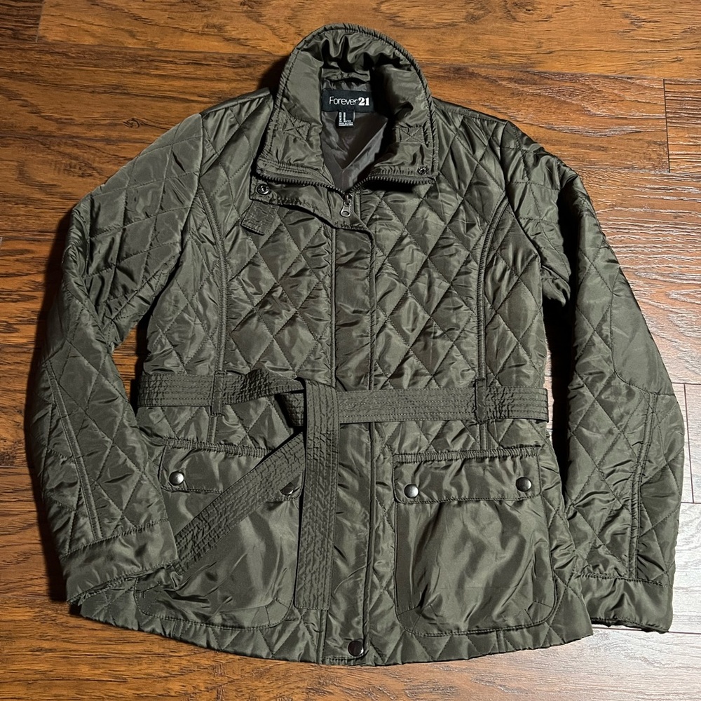 Super light puffer jacket in military green color.